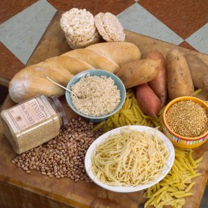 Grains: pasta, bread (includes pita pretzels etc), noodles, flour, wheat, cereal, rice, oats, corn. Many processed foods include grain derived ingredients. Not grains: potato, sweet potato, quinoa